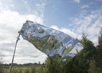 A flag made from an emergency blanket
