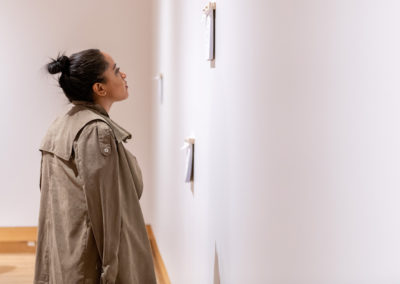A person looks at the work